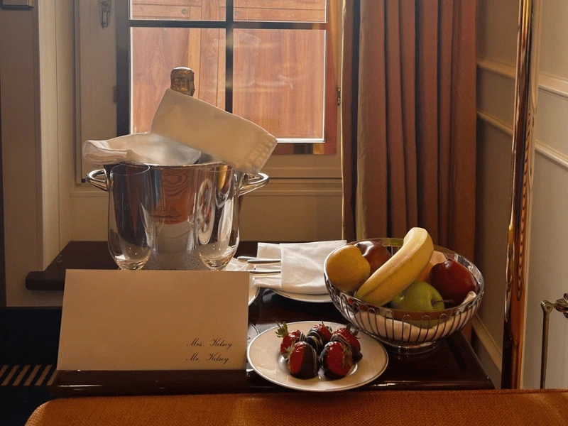 Champagne, fresh fruit and chocolate-covered strawberries waiting in a Sea Cloud Spirit suite