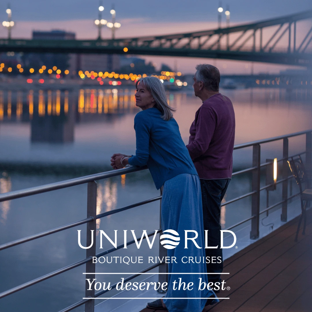Uniworld Boutique River Cruises couple enjoying sunset views on luxury river ship