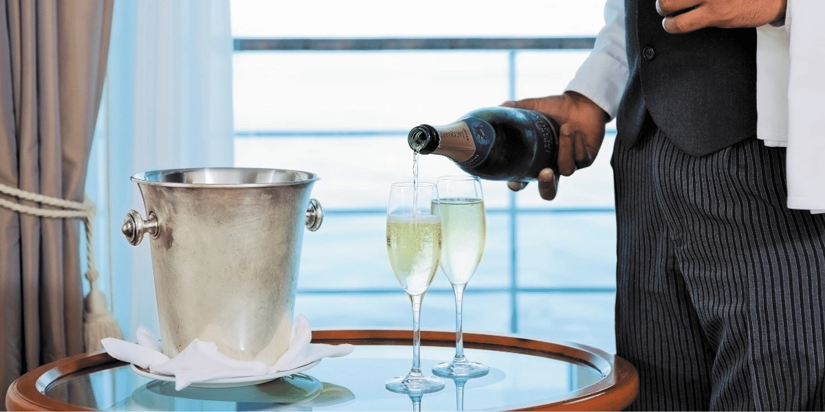 Guests enjoying luxury service aboard Regent Seven Seas Cruises