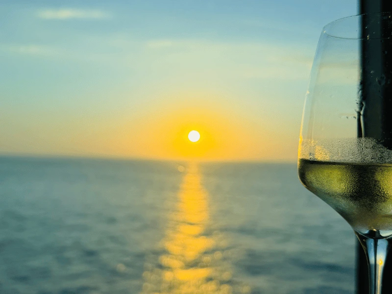 Sunset viewed from a window table in Red Ginger onboard Oceania Cruises' Sirena.