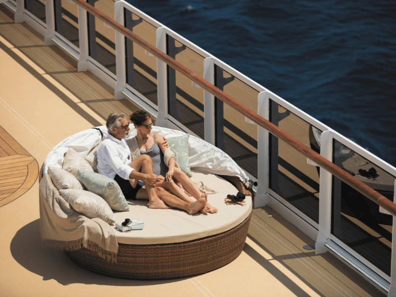 Couple relaxing together on the deck of a Regent Seven Seas ship