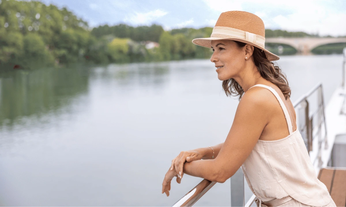 Solo traveller enjoying the view from a river cruise ship