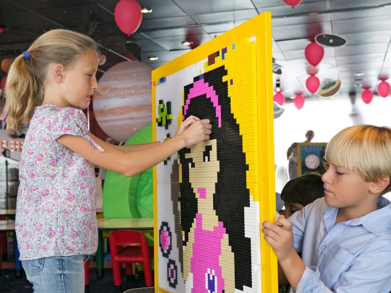 Children creating a LEGO mosaic during an MSC Cruises family activity