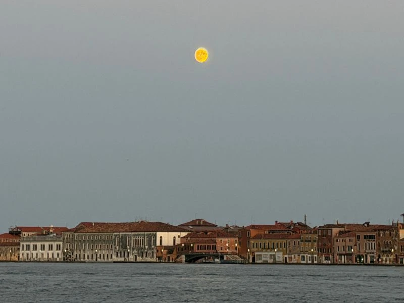 Moon rising above the Venice waterfront during a Uniworld lagoon cruise