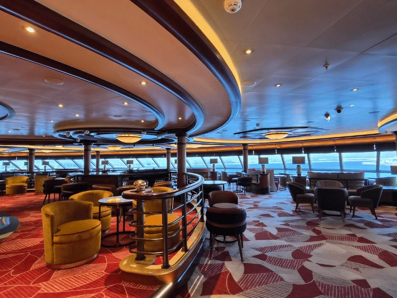 Commodore Club lounge with panoramic windows aboard Cunard Queen Elizabeth