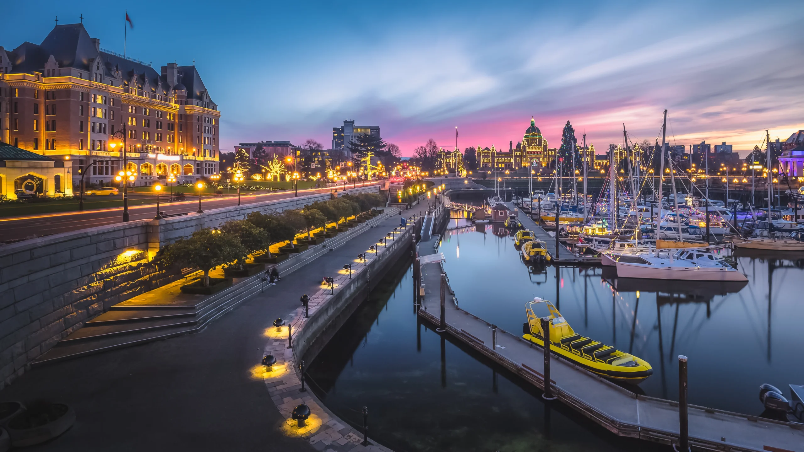 Victoria Inner Harbour with the Fairmont Empress and British Columbia Parliament Buildings at dusk